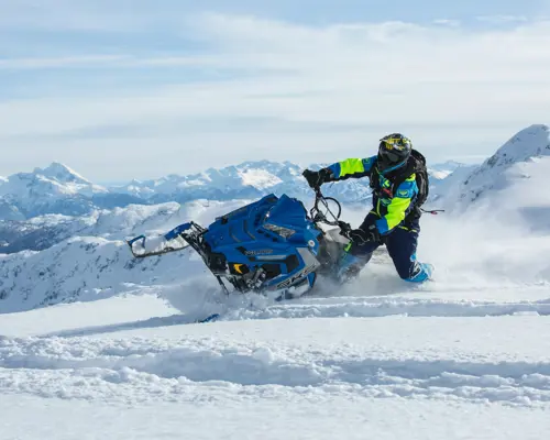 A man on a snowmobile.